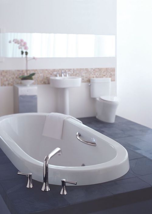 kohler nexus cast iron freestanding bathtub in cotton white with polished chrome drain finish