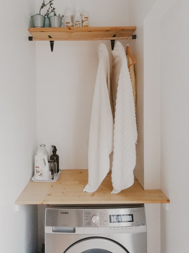 laundry room with hanging rod 