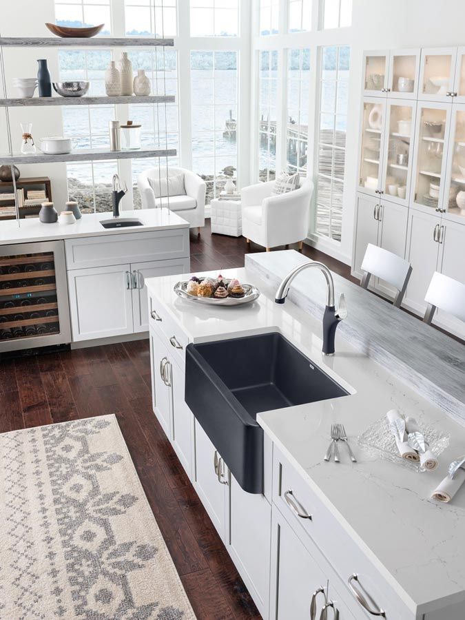 black farmhouse apron sink in beach kitchen