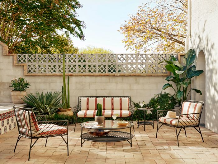 outdoor living space with couches and plants