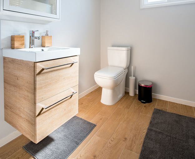 white toilet in a modern wood bathroom