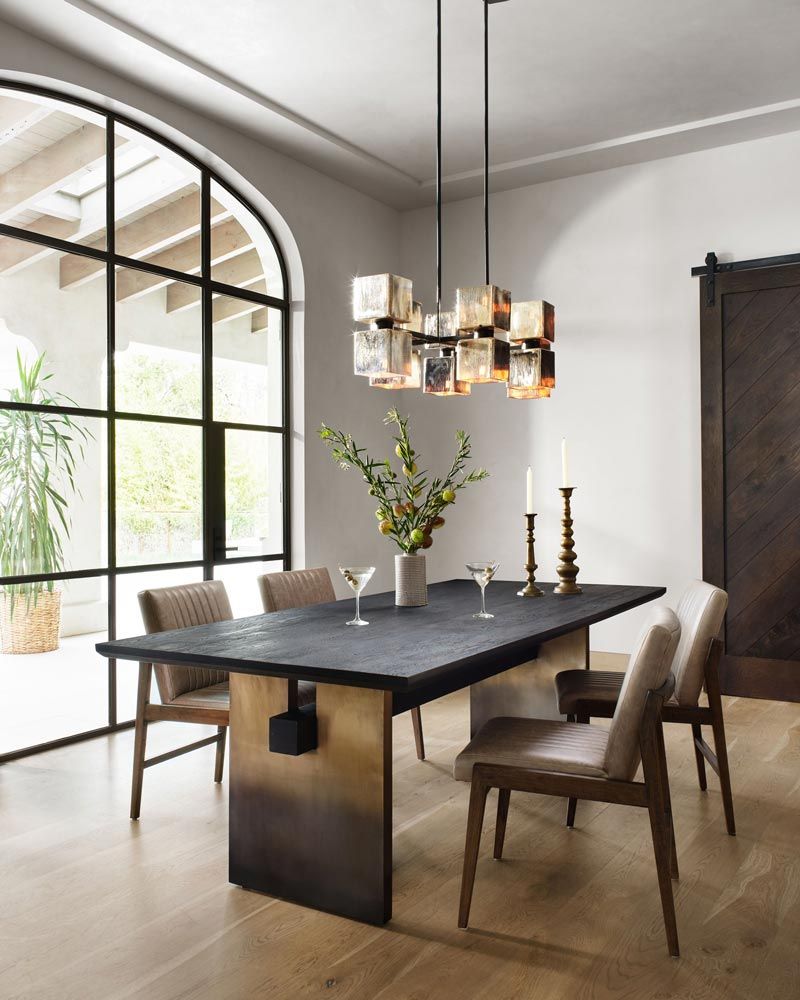 large window casting natural light on dining room