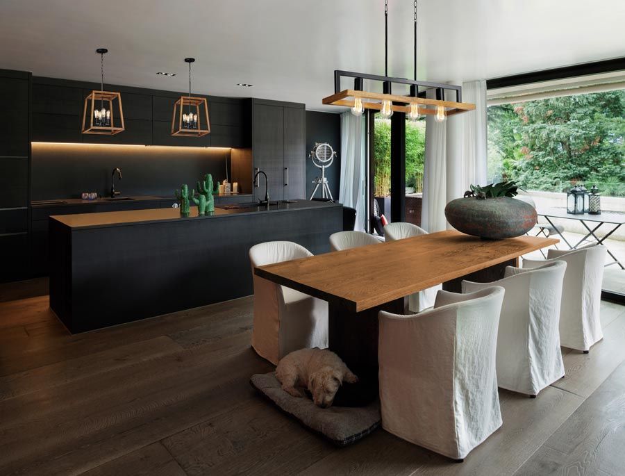 open kitchen with lighting over dining area