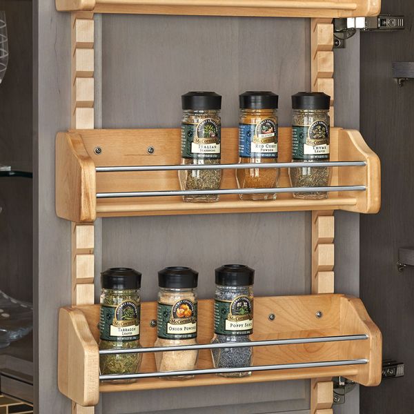 spice rack hanging on cabinet wall
