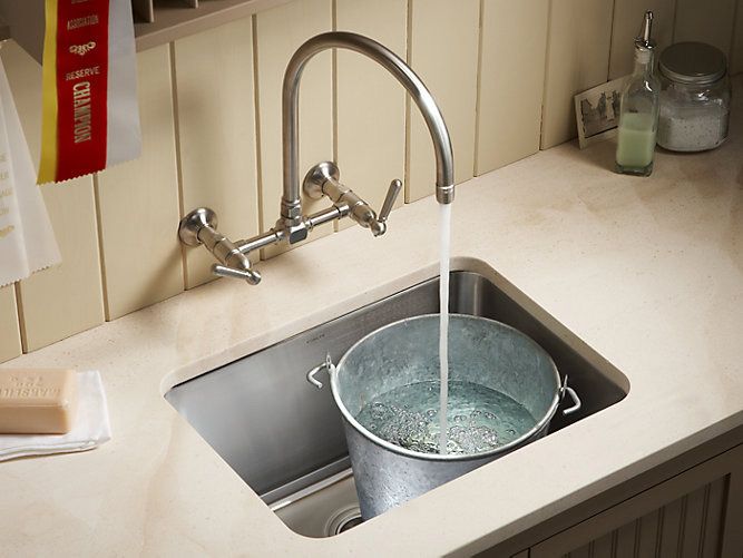 Wall mount faucet for a utility sink