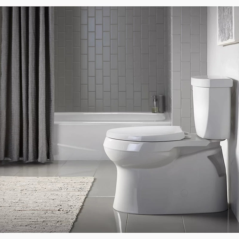 Cimarron Comfort Height Elongated 1.28 gpf Skirted Two-Piece Toilet in Biscuit