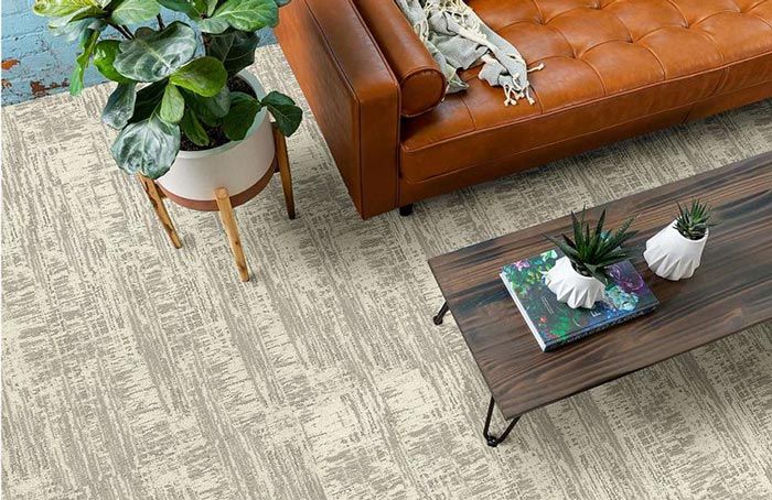 Bird's eye view of peel and stick carpet tile pattern in a living room