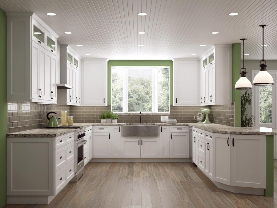 Modern farmhouse kitchen featuring shaker white cabinets