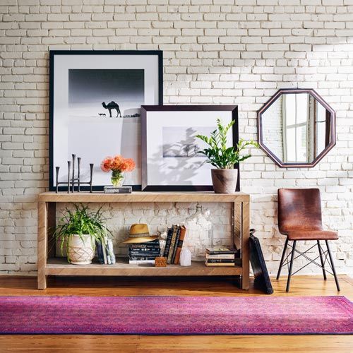 Four Hands Lamar Console Table decorated against a wall