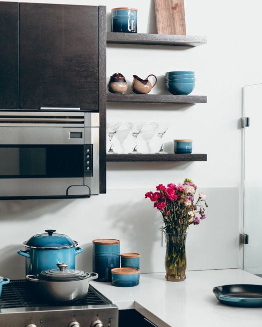 open wall shelving with blue accents