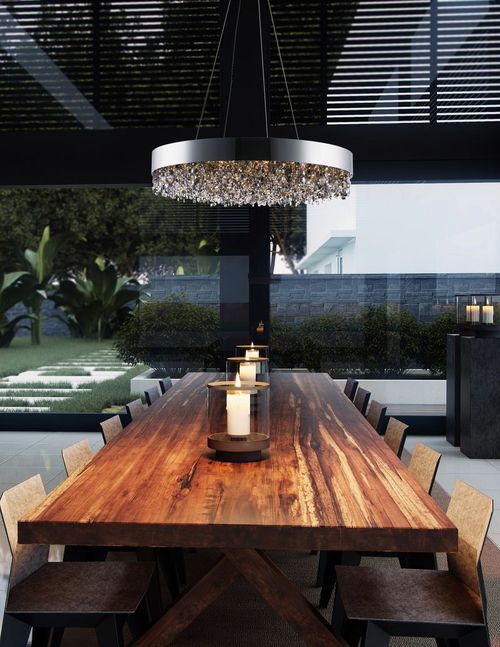 multi-pendant light in kitchen over table at night