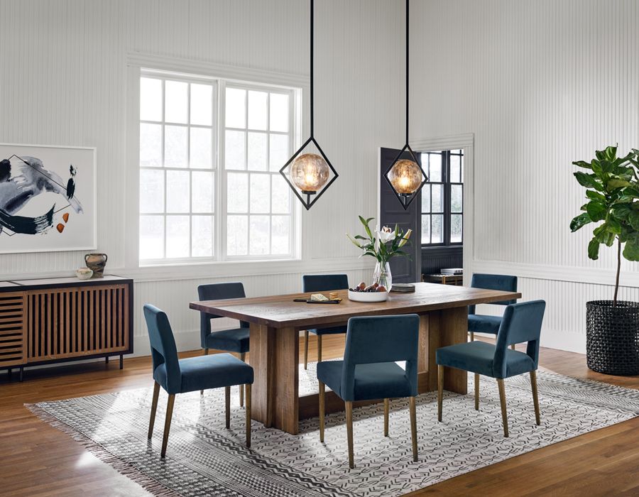 two kitchen pendants hanging over kitchen table