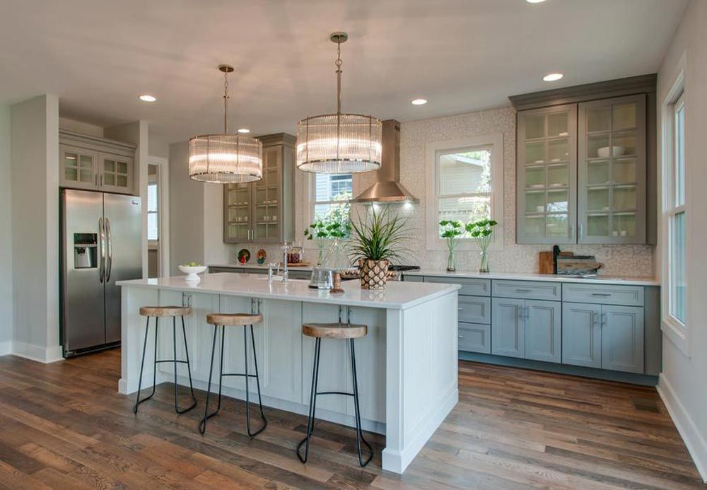 Kitchen with white slab cabinets