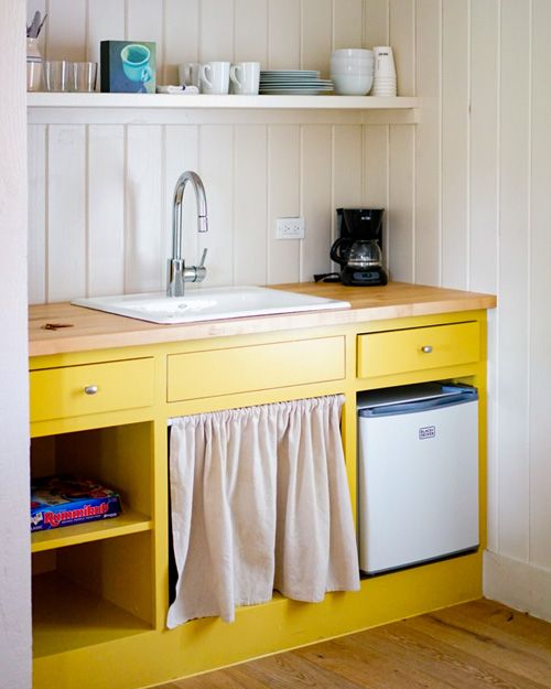 yellow cabinets with curtains