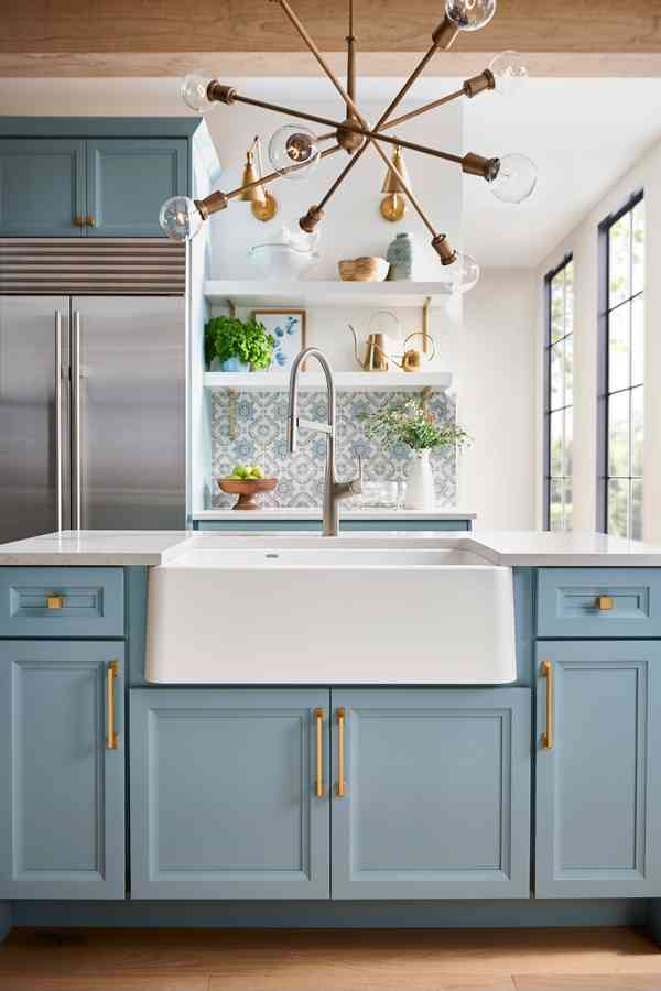 kitchen sink base cabinet, featuring blue cabinets and farmhouse style kitchen