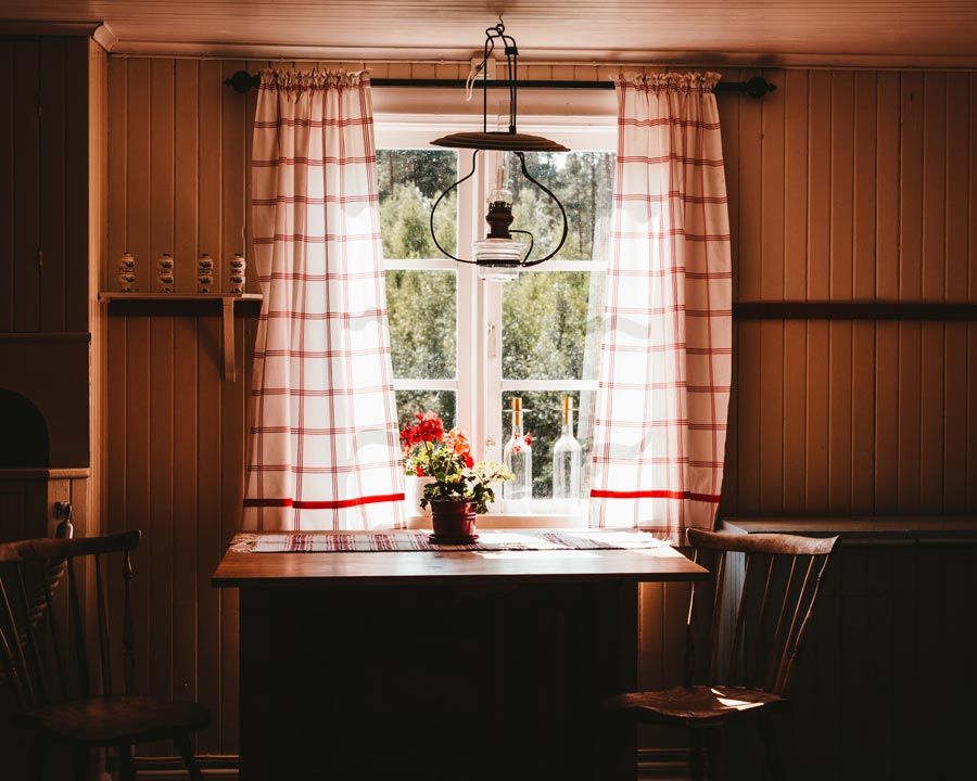 cottage with red curtains